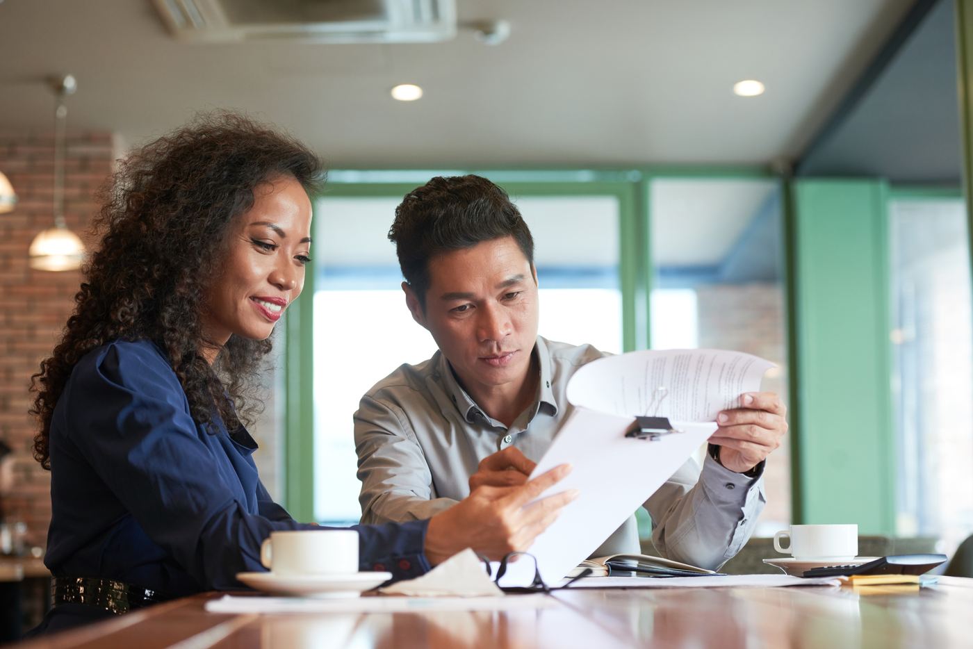 A SafetyBench professional reviewing documents with a client